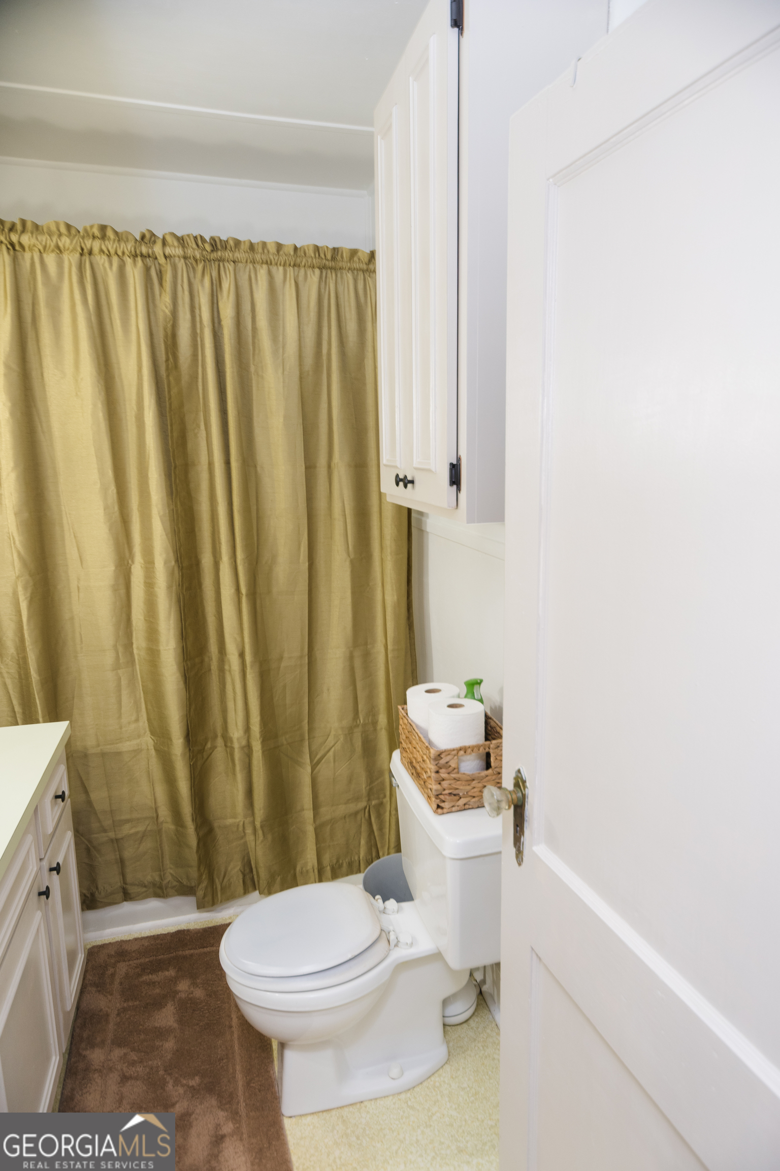 348 Americus Highway Butler, GA 31006 - Photo 27 of 59 a white toilet sitting next to a shower curtain