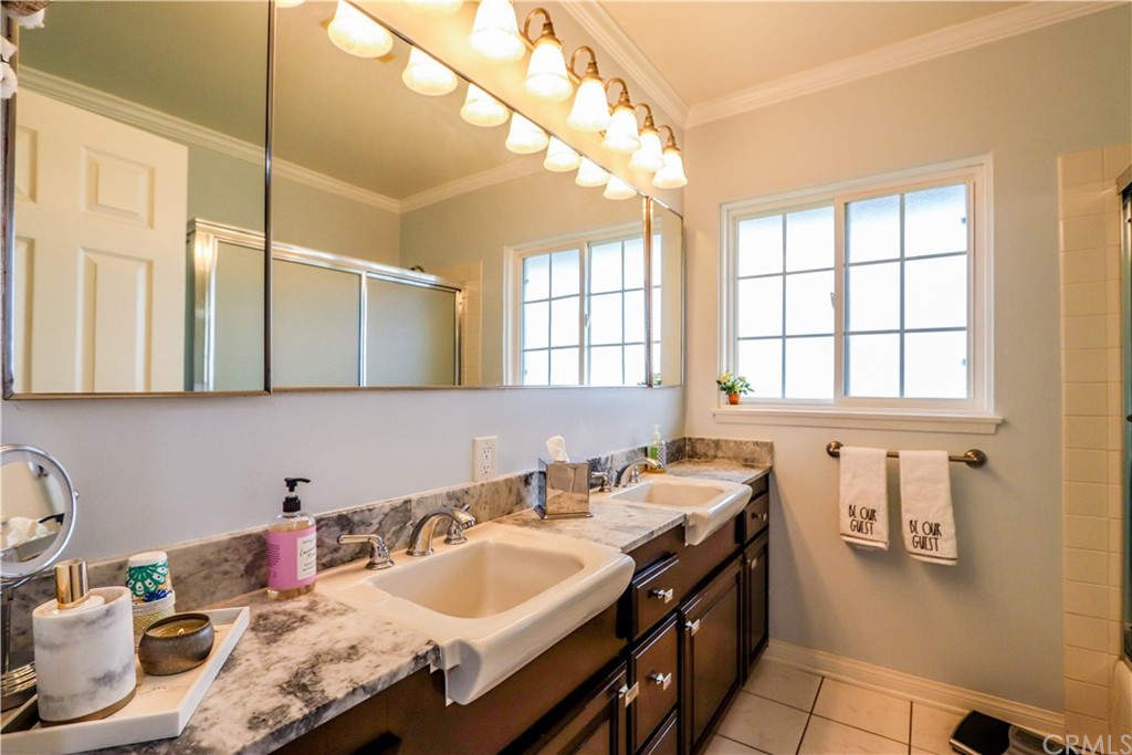 3213 Twilight Drive Fullerton, CA 92835 - Photo 16 of 47 a bathroom with a granite countertop sink and a mirror