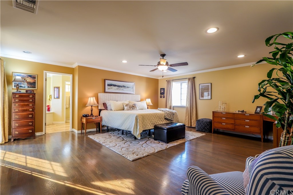 3213 Twilight Drive Fullerton, CA 92835 - Photo 19 of 47 a spacious bedroom with a bed a couch and a potted plant