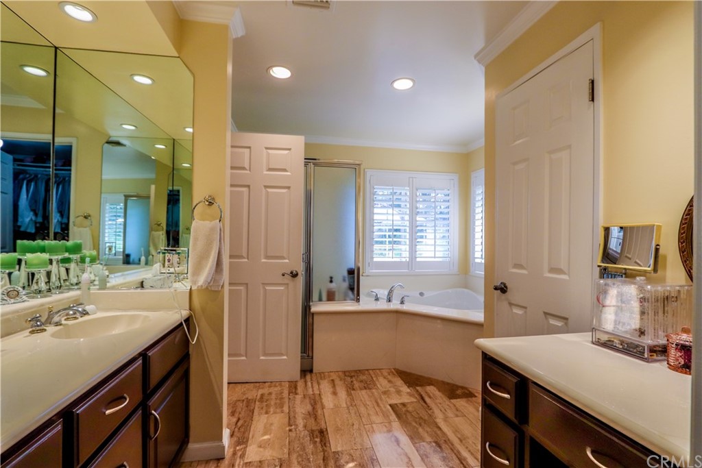 3213 Twilight Drive Fullerton, CA 92835 - Photo 20 of 47 a bathroom with a sink a vanity a mirror and a bathtub
