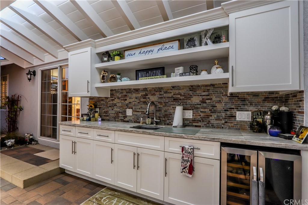 3213 Twilight Drive Fullerton, CA 92835 - Photo 40 of 47 a kitchen with stainless steel appliances granite countertop a sink stove and cabinets