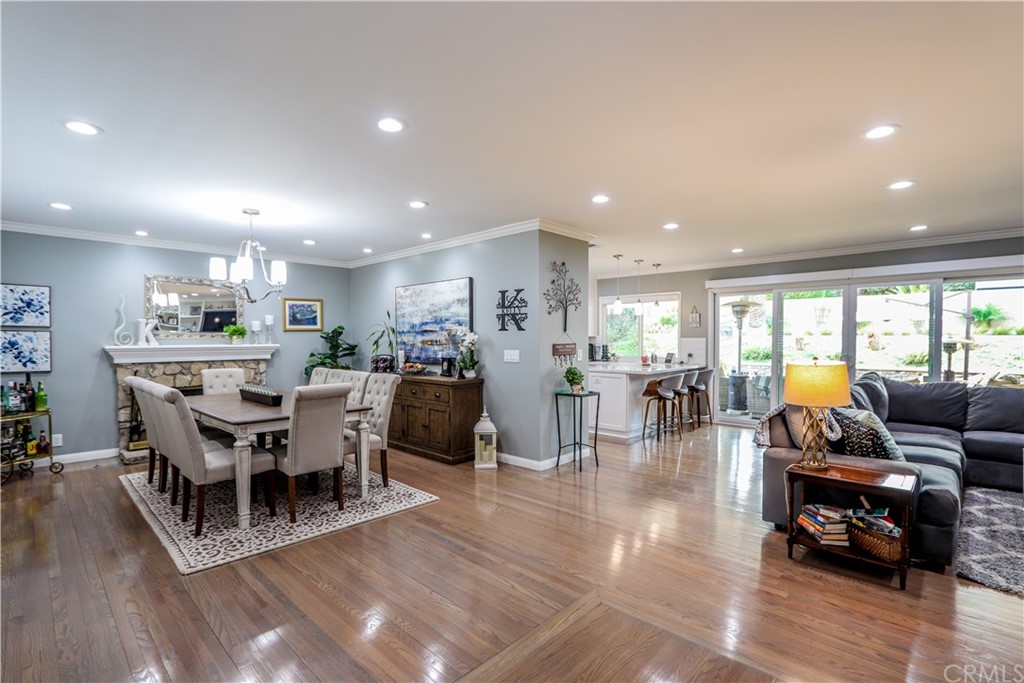 3213 Twilight Drive Fullerton, CA 92835 - Photo 4 of 47 a living room with lots of furniture a wooden floor and a chandelier