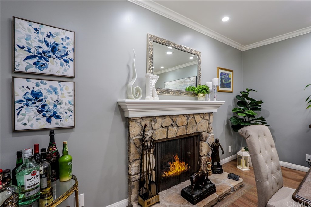 3213 Twilight Drive Fullerton, CA 92835 - Photo 6 of 47 a room with painting on the wall and a fireplace