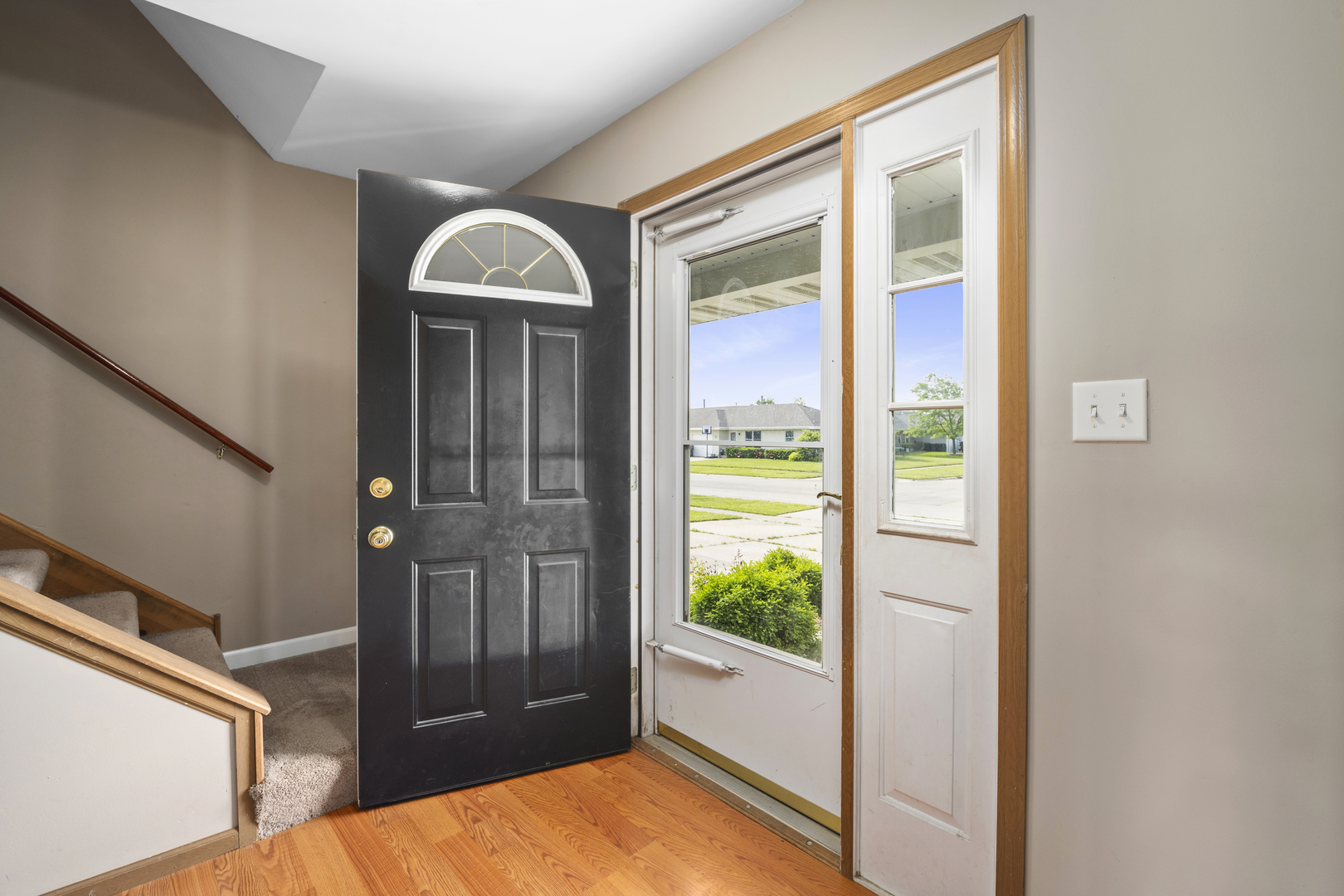 522 Hunters Run Coal City, IL 60416 - Photo 2 of 24 a view of a hallway with wooden floor and glass door