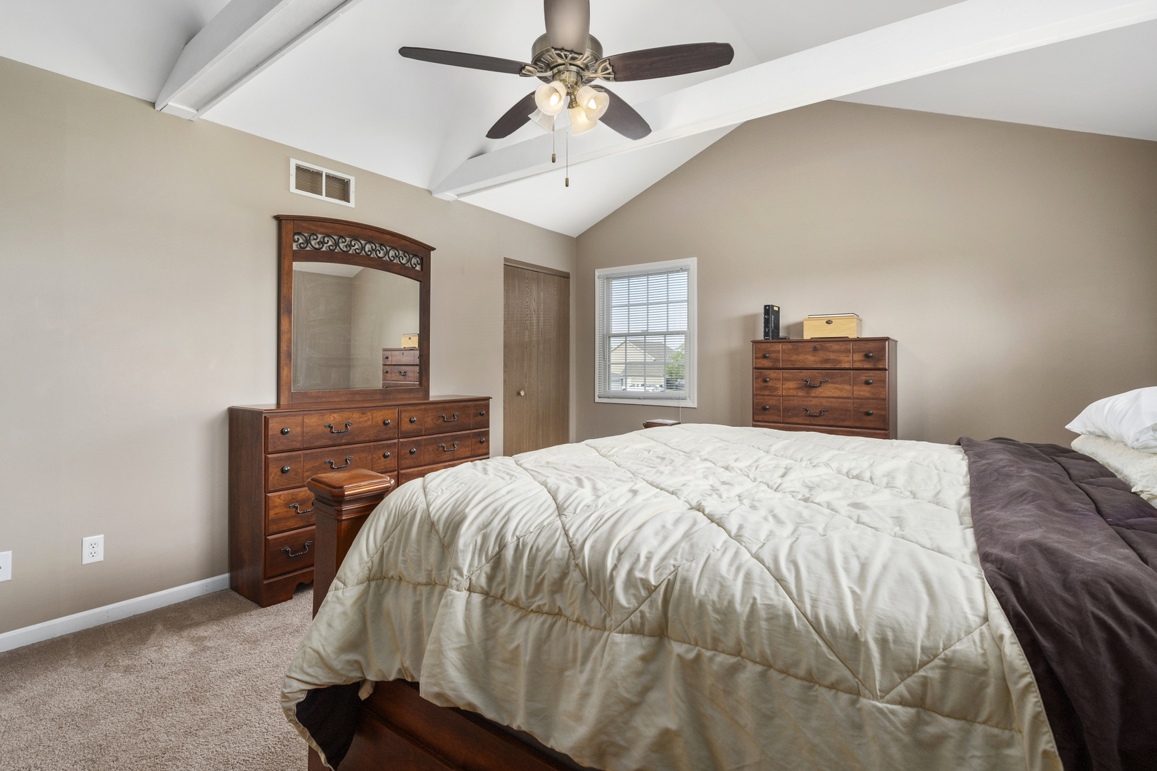 522 Hunters Run Coal City, IL 60416 - Photo 12 of 24 a bedroom with a bed and a chandelier