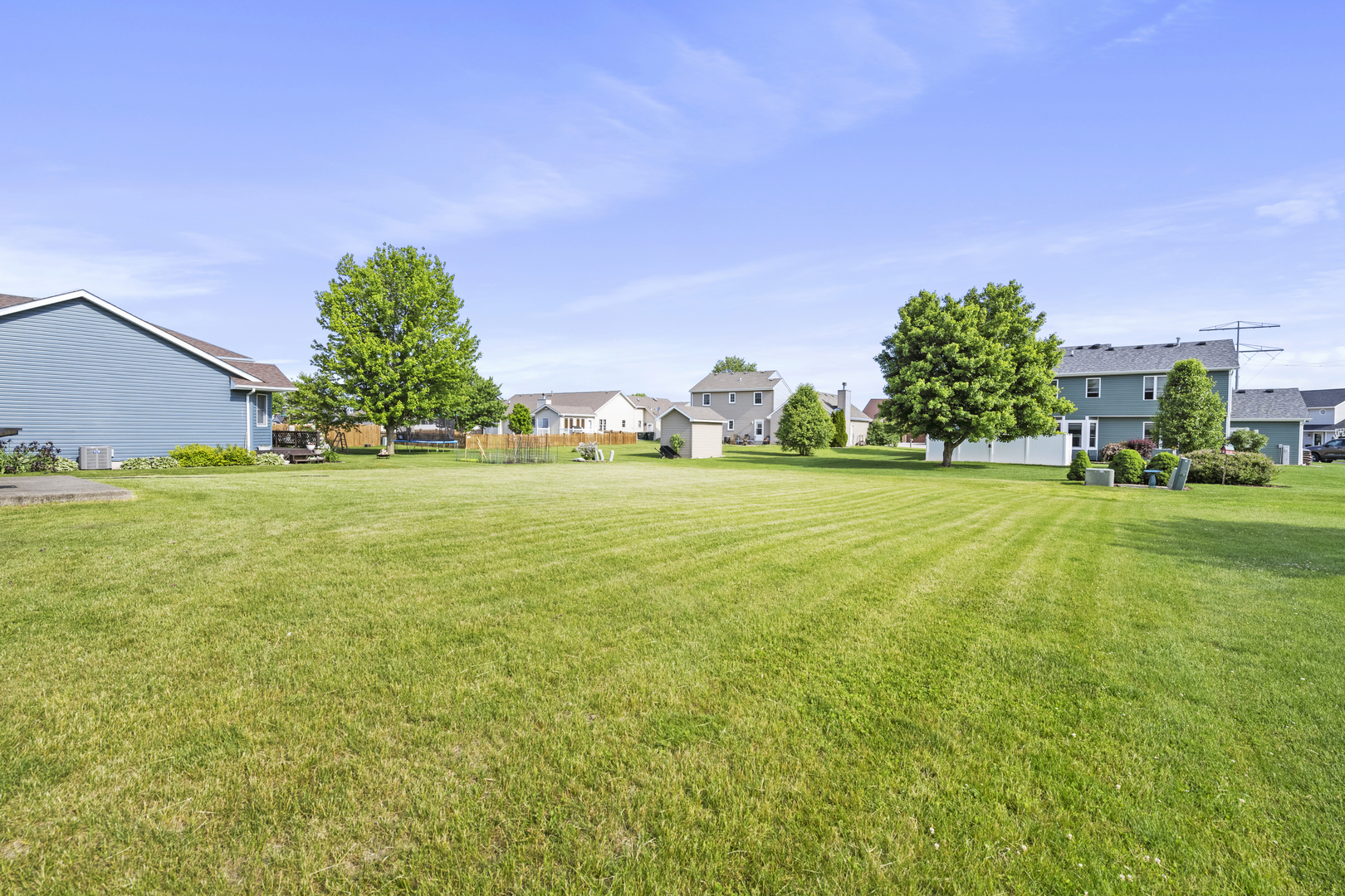 522 Hunters Run Coal City, IL 60416 - Photo 24 of 24 a view of a grassy field with an trees in the background
