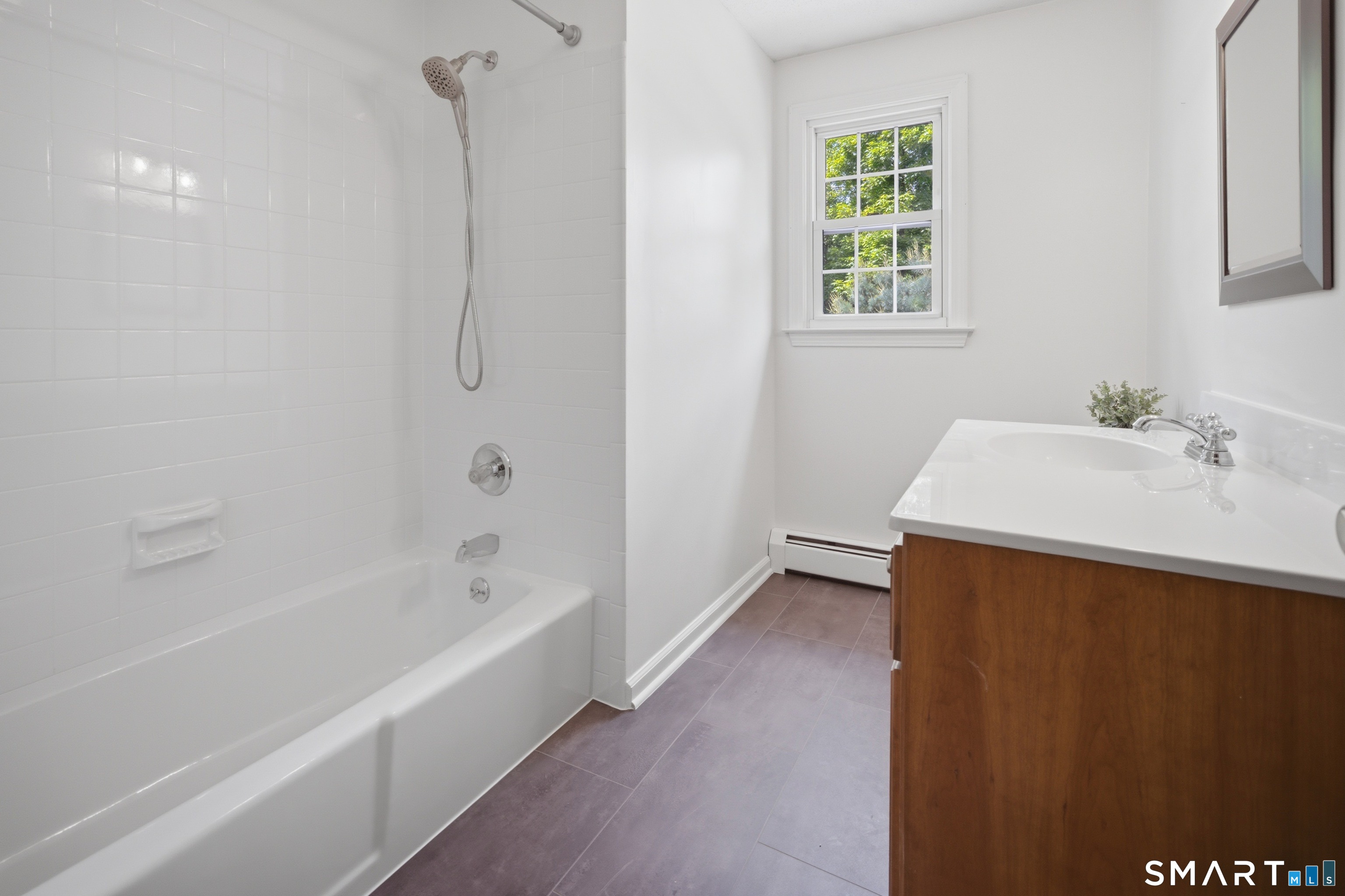 211 Valley View Road Manchester, CT 06040 - Photo 32 of 39 a bathroom with a bathtub and a sink