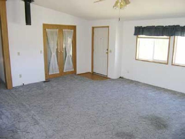 3153 Beaudry Road Moxee, WA 98936 - Photo 3 of 8 an empty room with windows and closet