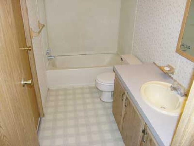 3153 Beaudry Road Moxee, WA 98936 - Photo 7 of 8 a bathroom with a granite countertop sink toilet and shower