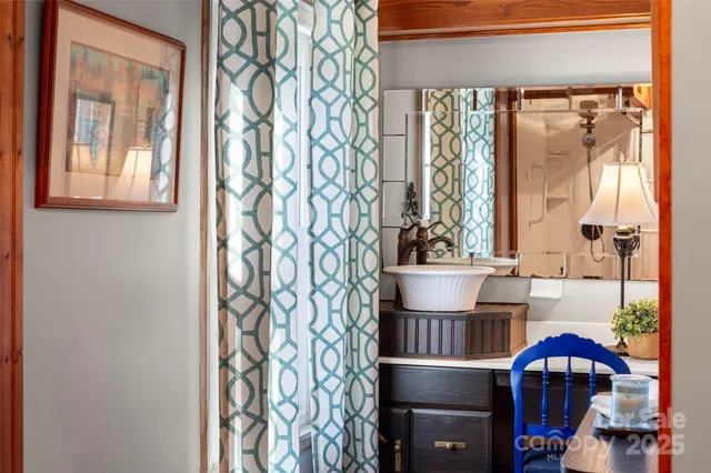 a kitchen with a window and cabinets