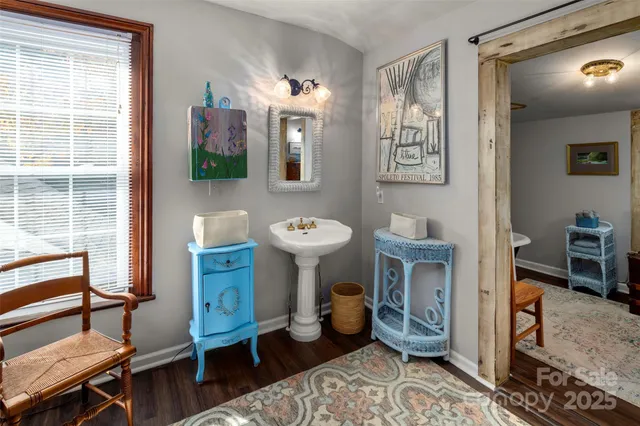 a living room with furniture a table and chairs