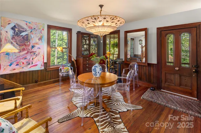 a view of a dining room with furniture window and wooden floor