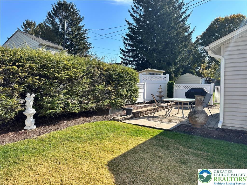 1795 Canal Street, Unit R Northampton, PA 18067 - Photo 6 of 15 a view of a backyard with plants and a patio
