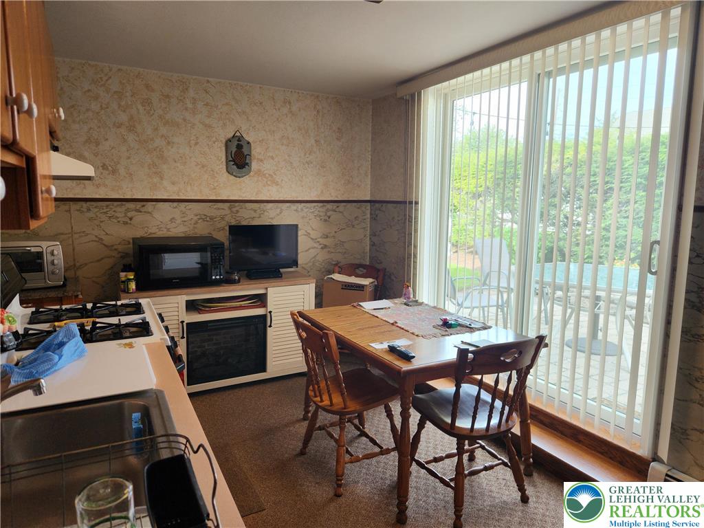 1795 Canal Street, Unit R Northampton, PA 18067 - Photo 8 of 15 a view of a dining room with furniture and a window