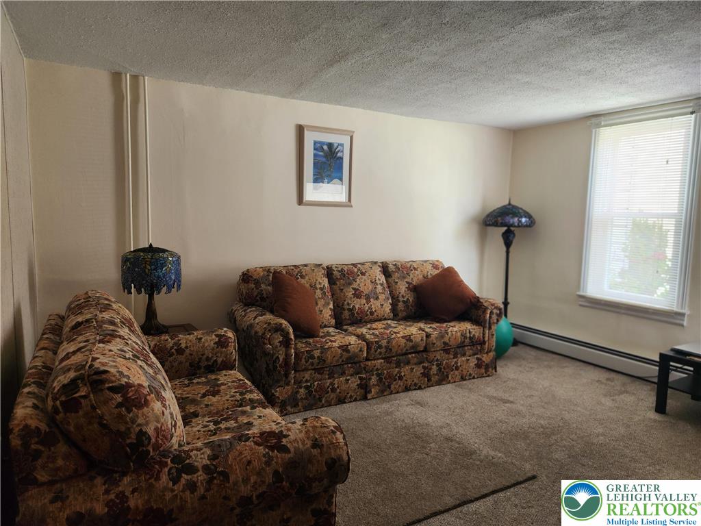 1795 Canal Street, Unit R Northampton, PA 18067 - Photo 9 of 15 a living room with furniture and a window