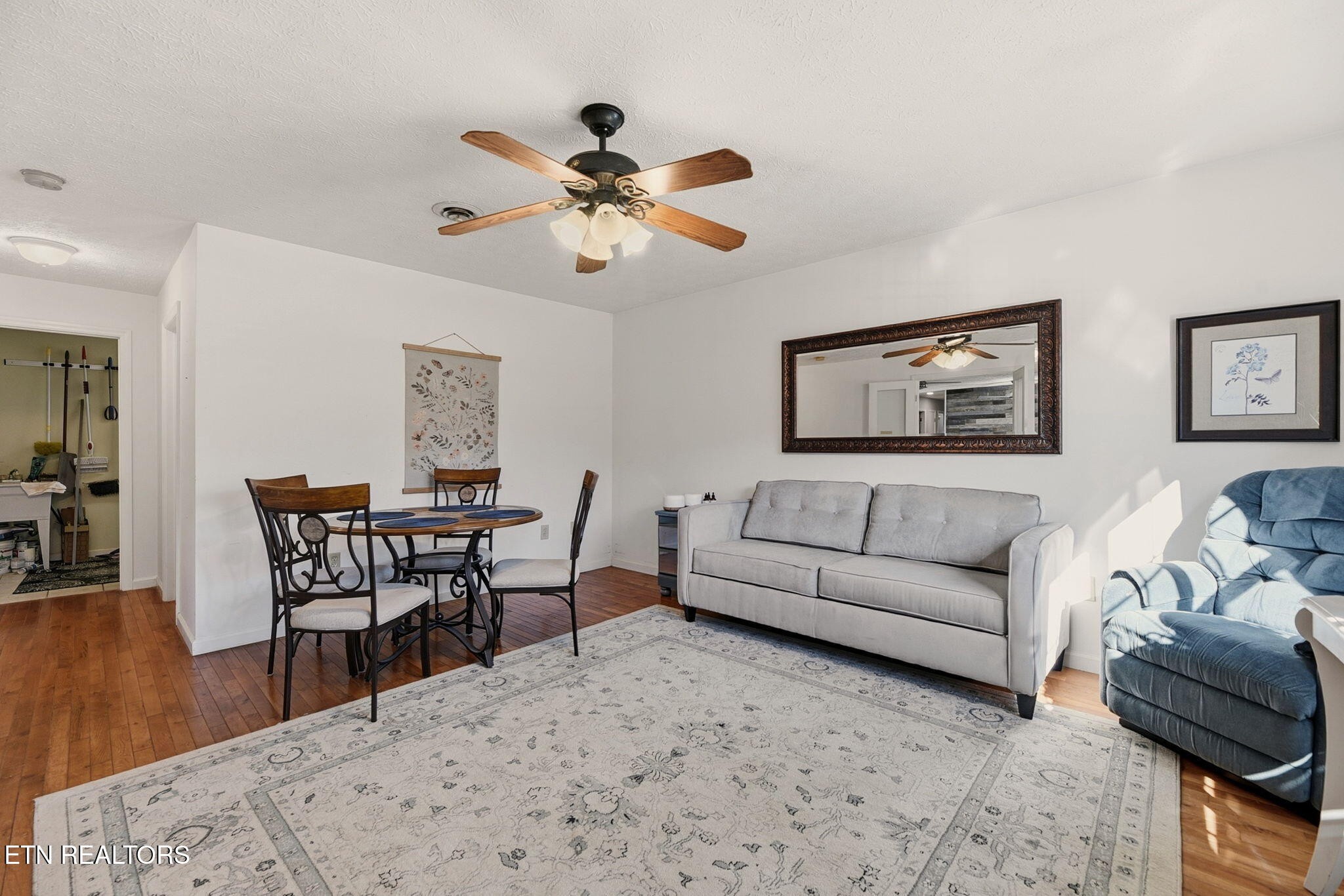 148 Batley Loop Road Clinton, TN 37716 - Photo 12 of 30 a living room with furniture wooden floor and a chandelier