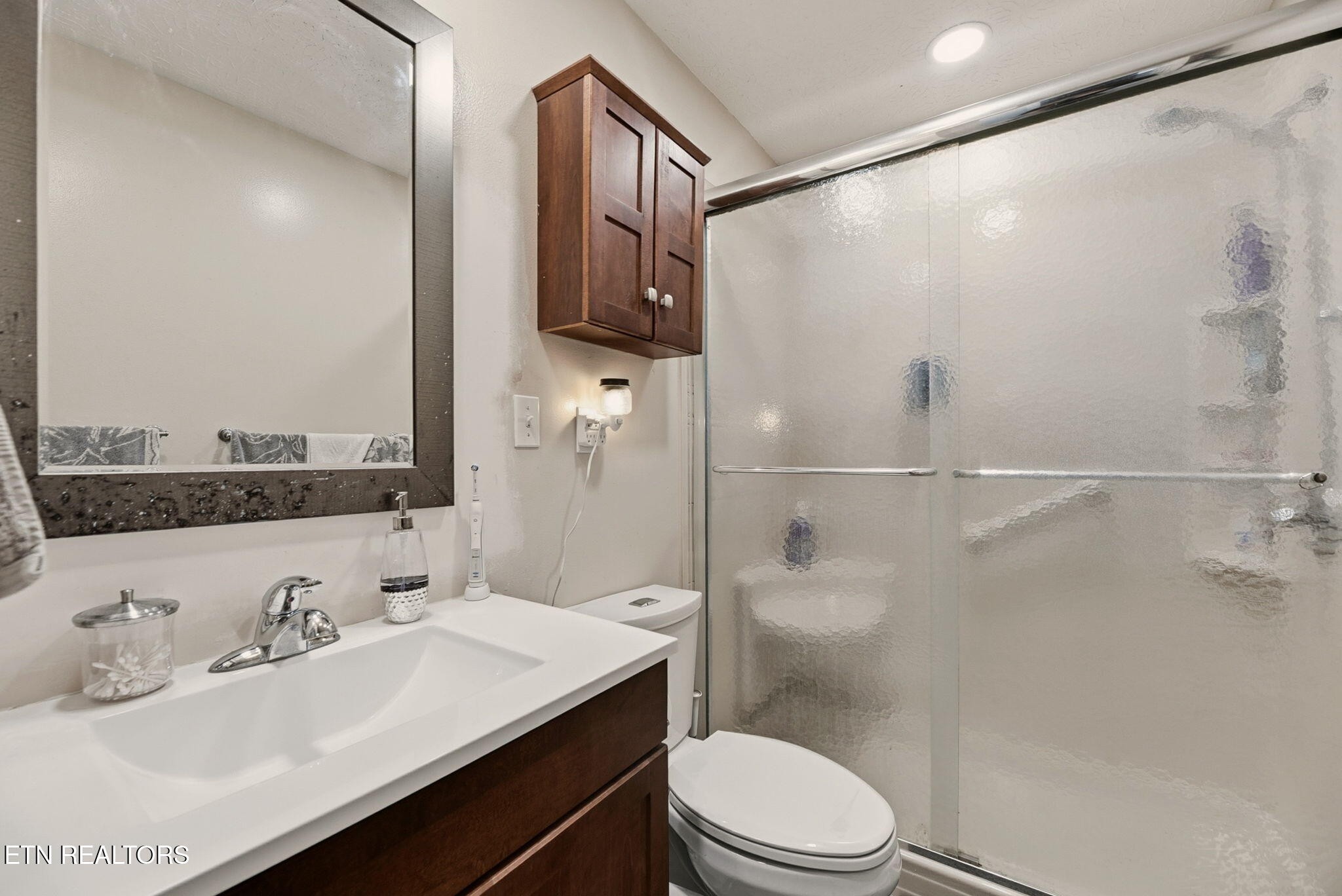 148 Batley Loop Road Clinton, TN 37716 - Photo 20 of 30 a bathroom with a sink toilet and shower