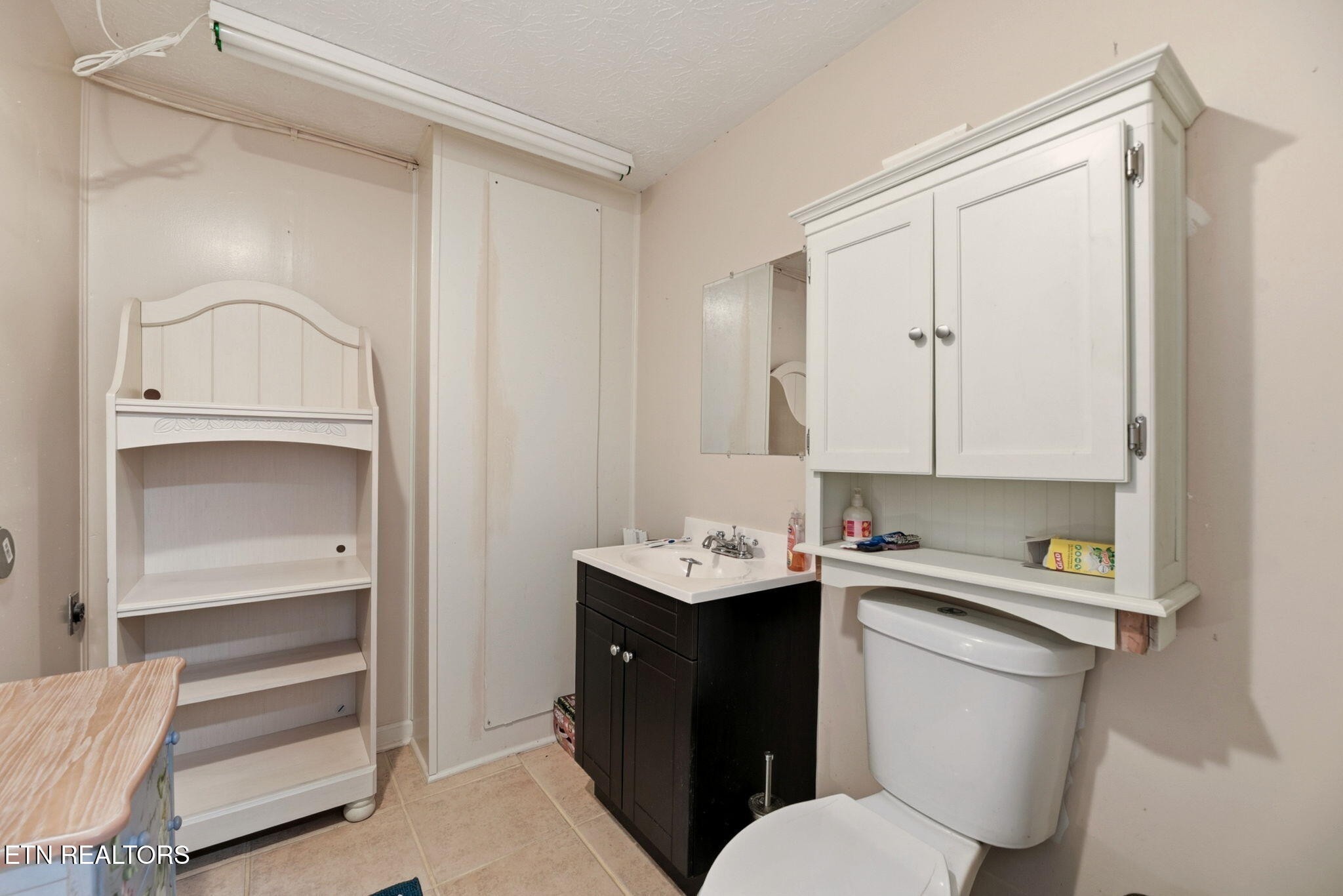 148 Batley Loop Road Clinton, TN 37716 - Photo 25 of 30 a bathroom with a sink toilet and vanity