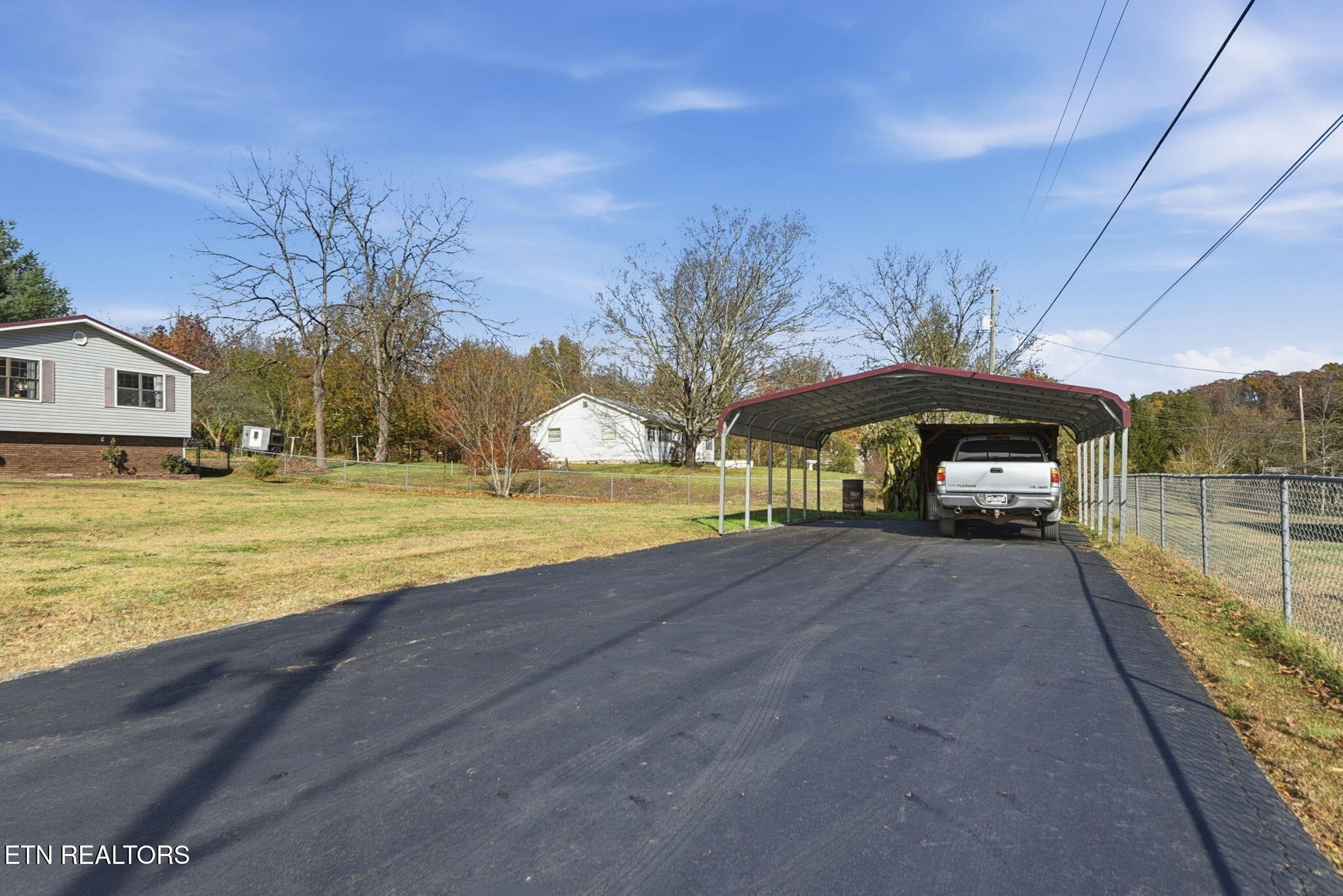 148 Batley Loop Road Clinton, TN 37716 - Photo 30 of 30 a view of a house with a yard and balcony