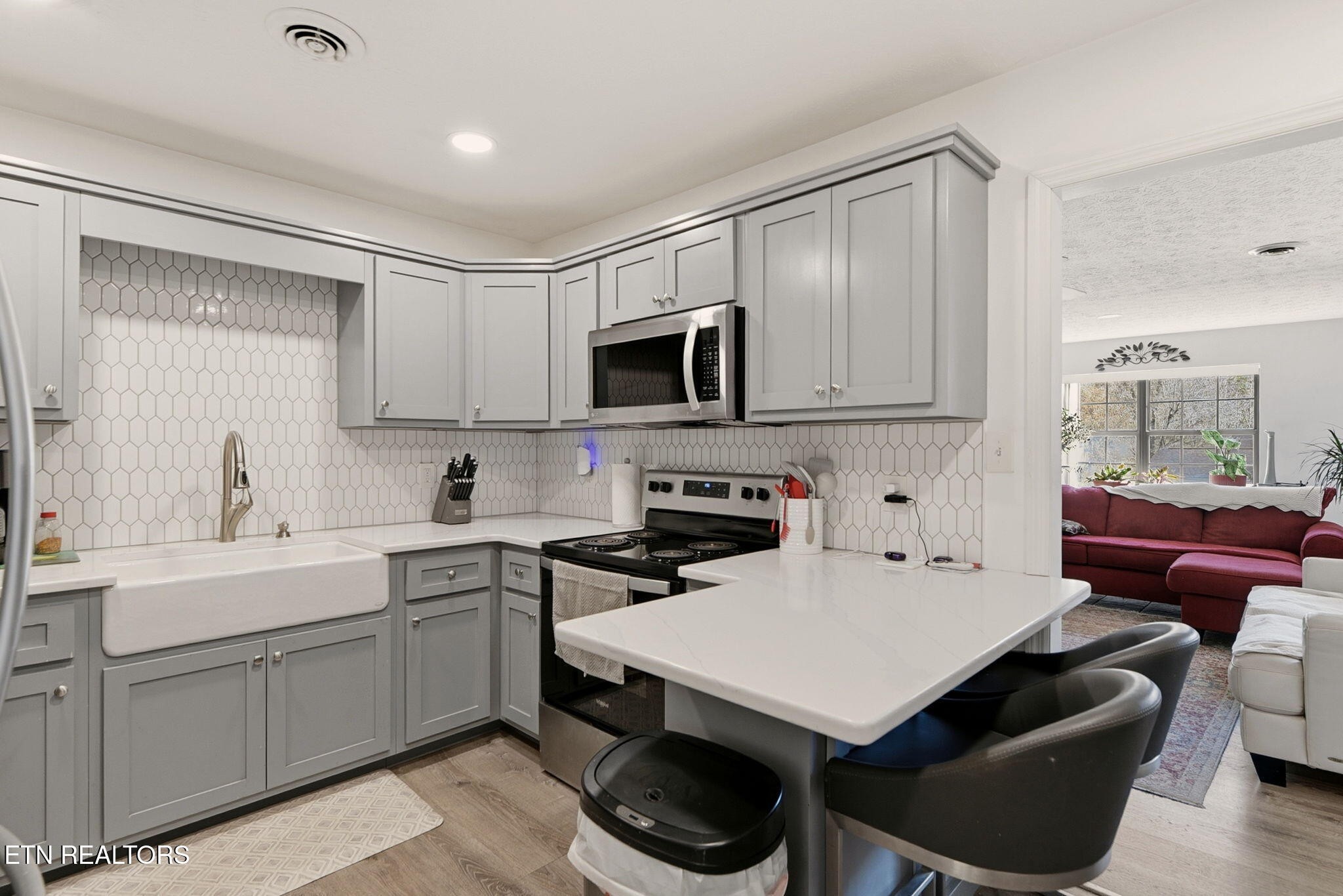 148 Batley Loop Road Clinton, TN 37716 - Photo 8 of 30 a kitchen with a sink cabinets and wooden floor