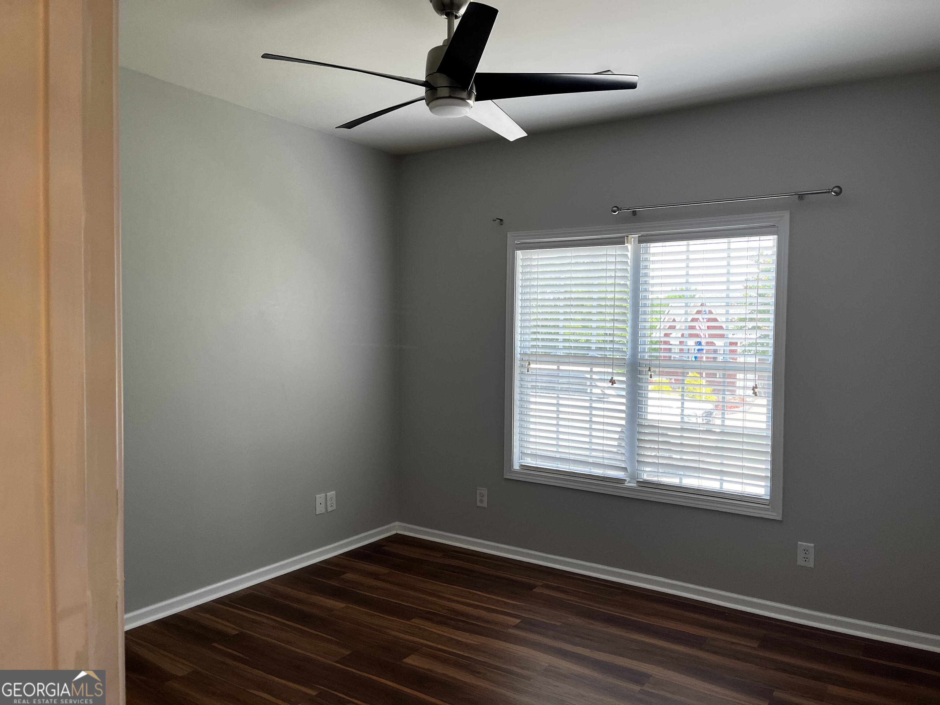 779 Appian Way Statham, GA 30666 - Photo 16 of 29 a view of an empty room with wooden floor and a window