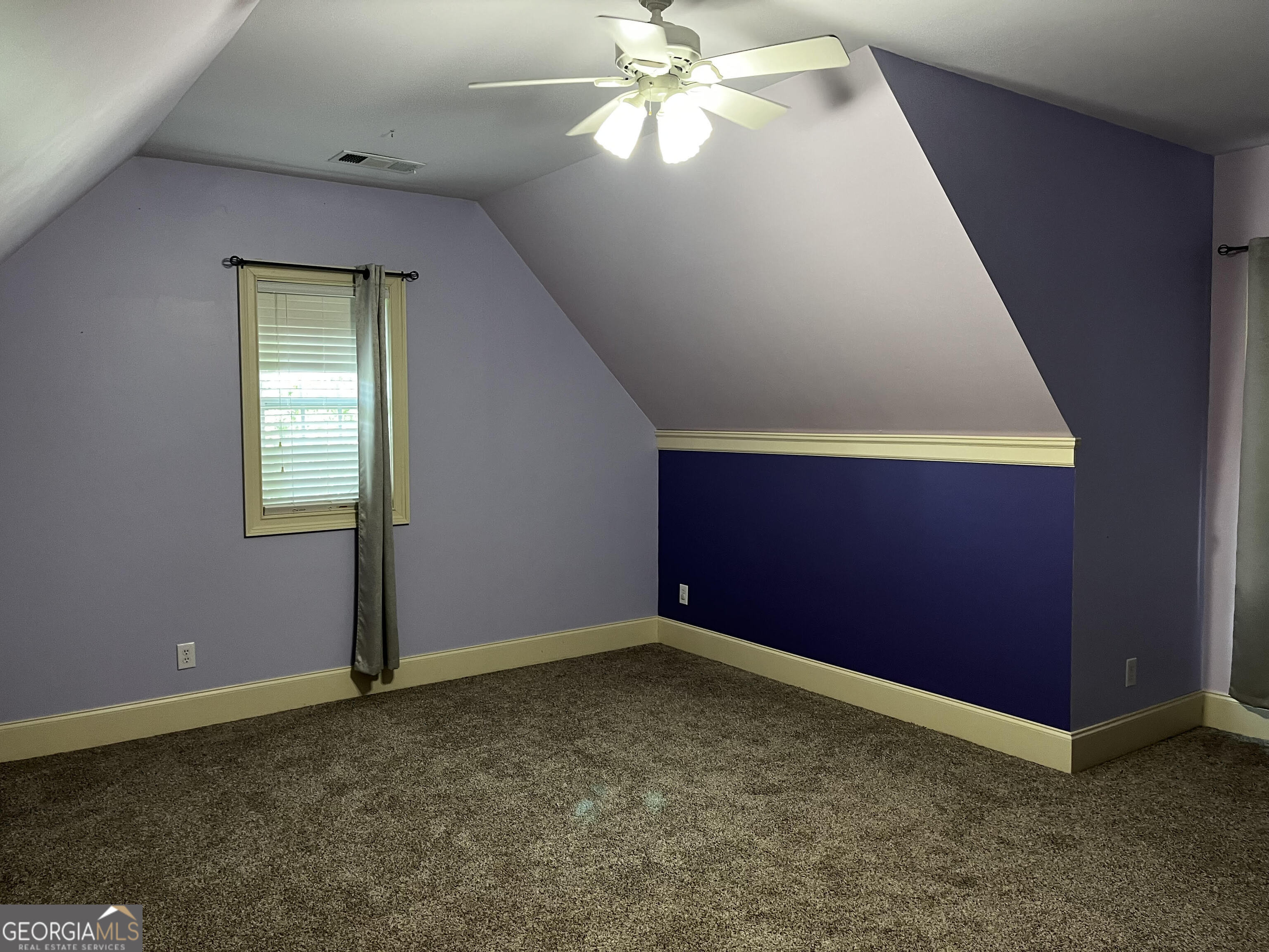 779 Appian Way Statham, GA 30666 - Photo 21 of 29 an empty room with windows and fan