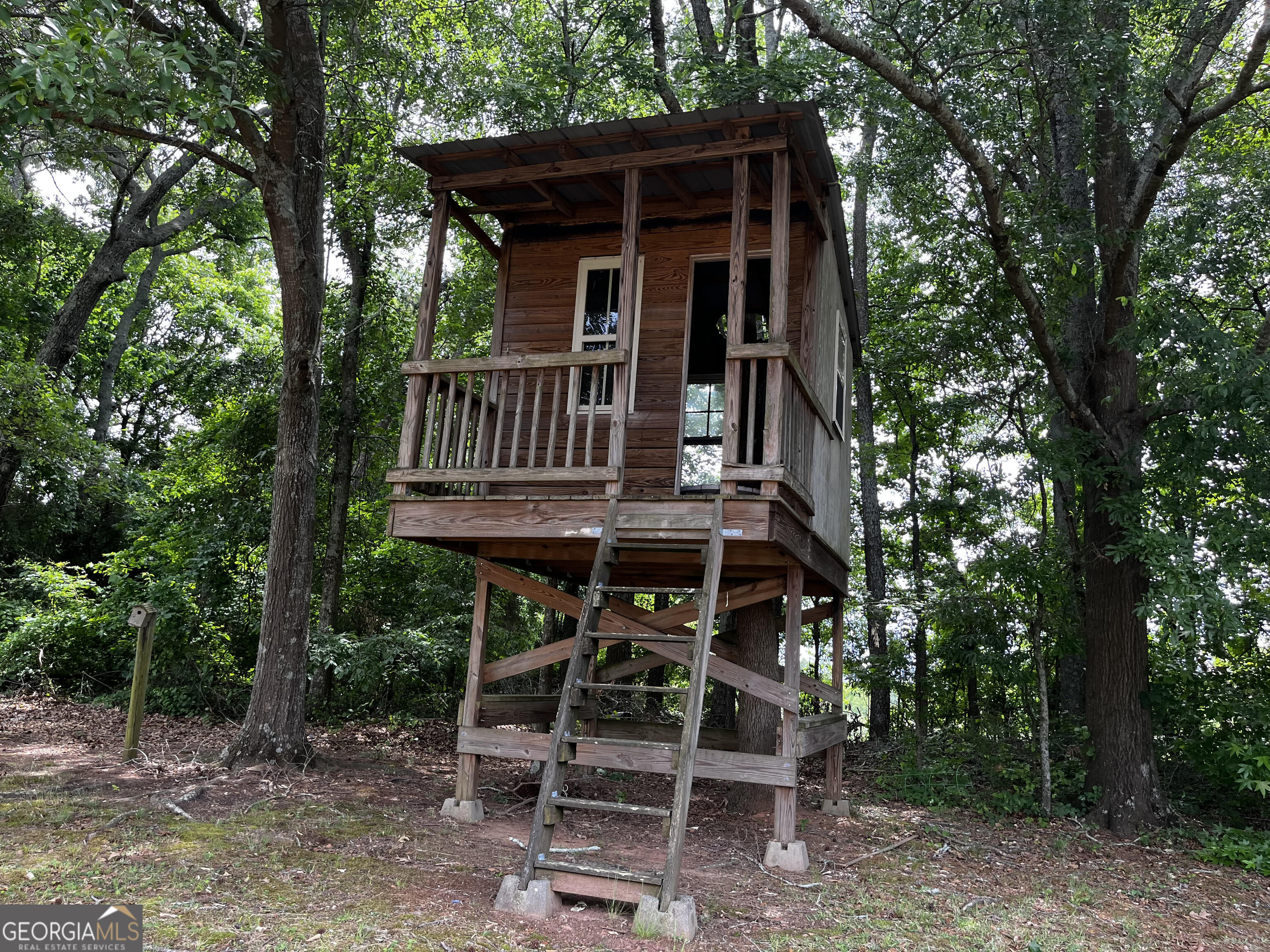 779 Appian Way Statham, GA 30666 - Photo 27 of 29 a view of a chair and table in the backyard