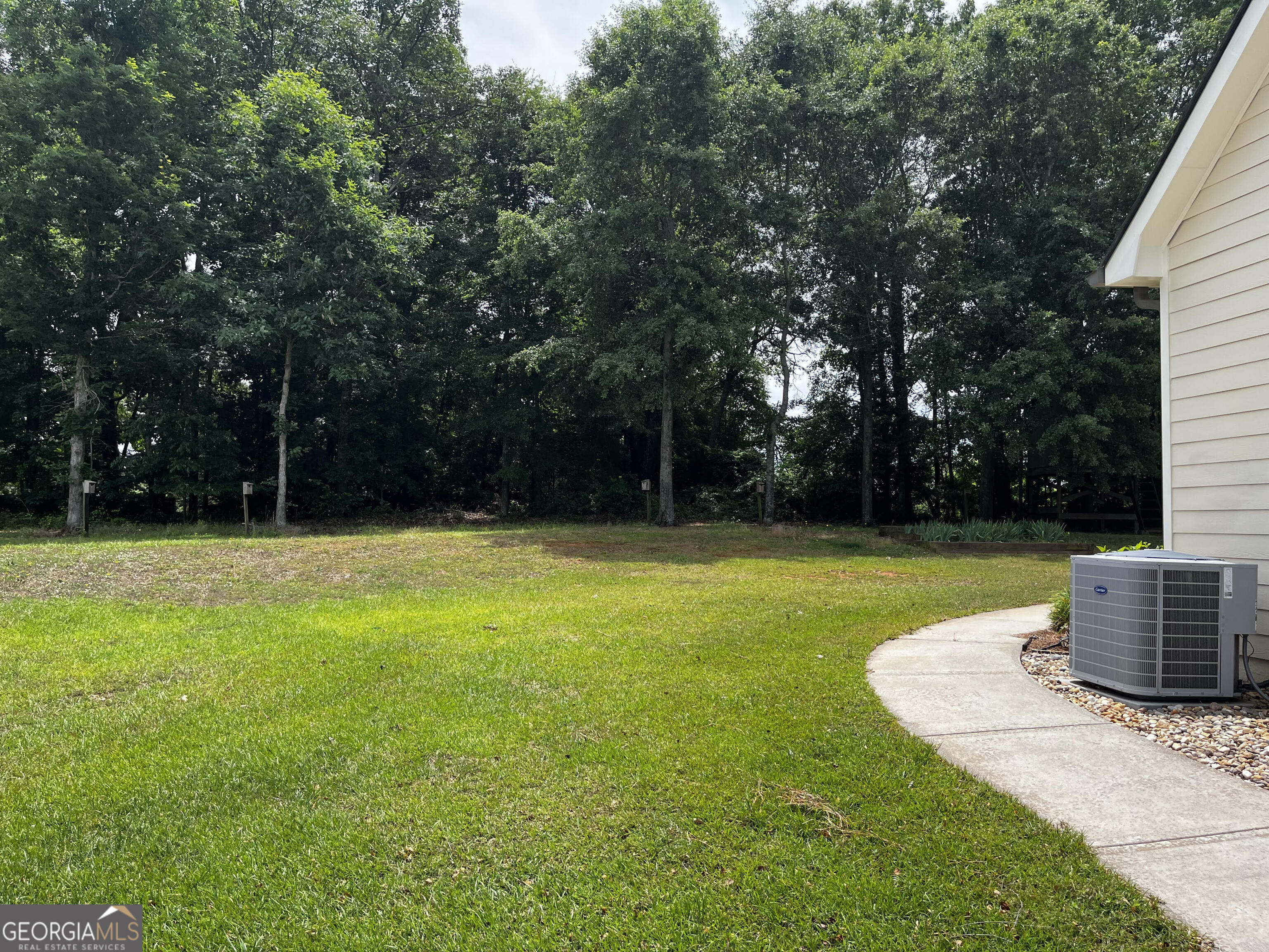 779 Appian Way Statham, GA 30666 - Photo 28 of 29 a view of a garden with a barbeque