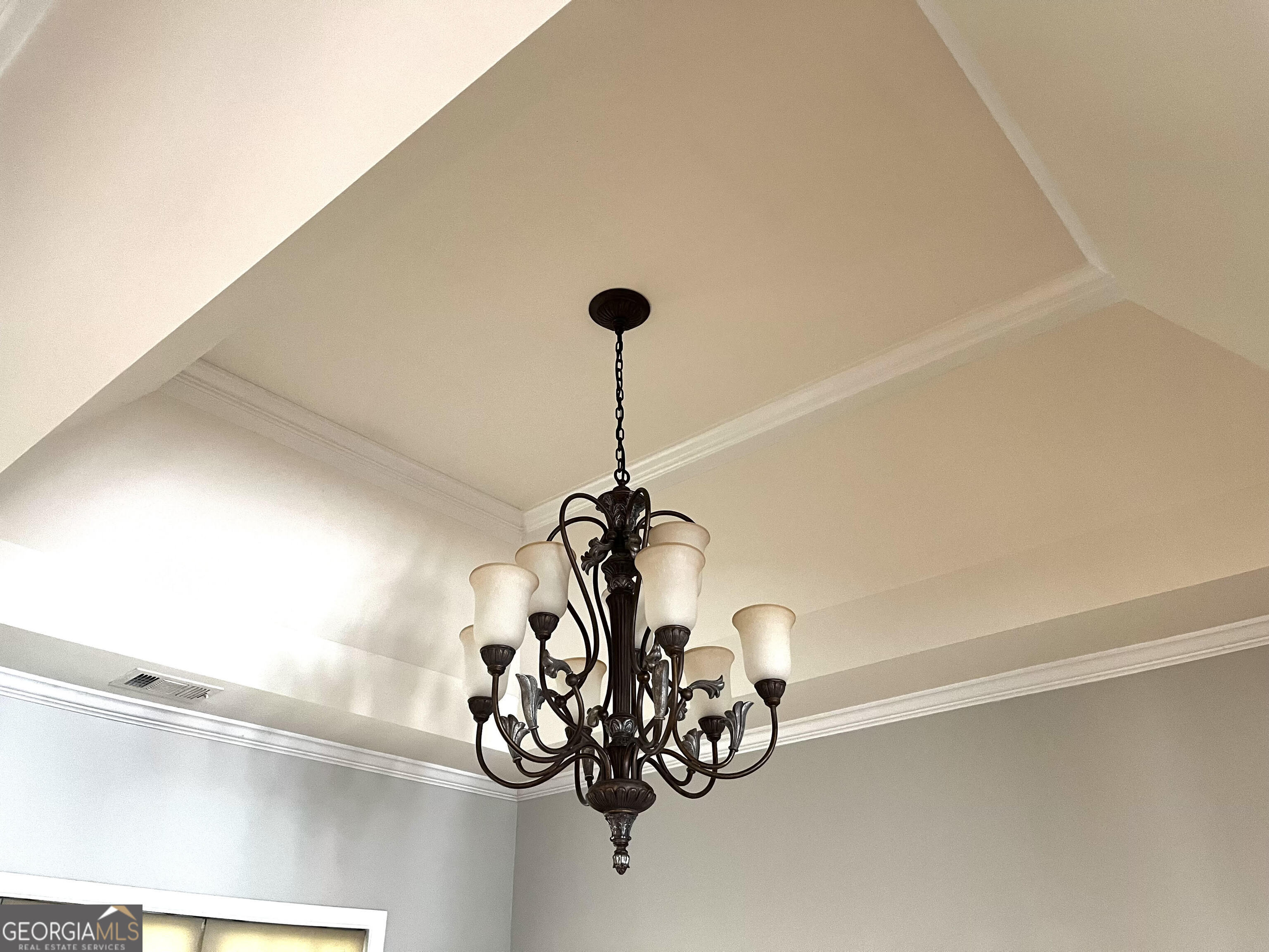 779 Appian Way Statham, GA 30666 - Photo 6 of 29 a view of a chandelier fan and a window