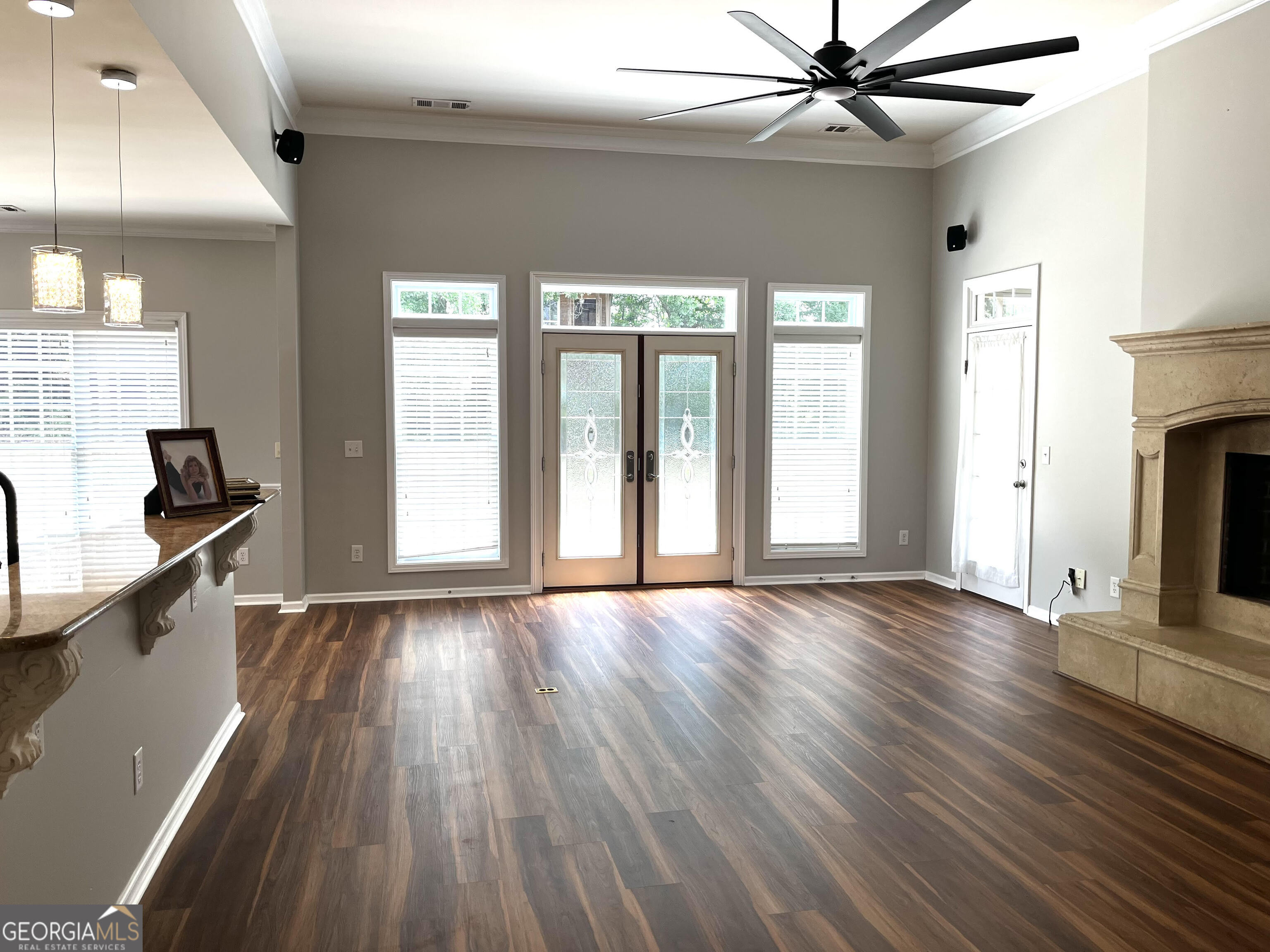 779 Appian Way Statham, GA 30666 - Photo 7 of 29 a view of an empty room with wooden floor and a window