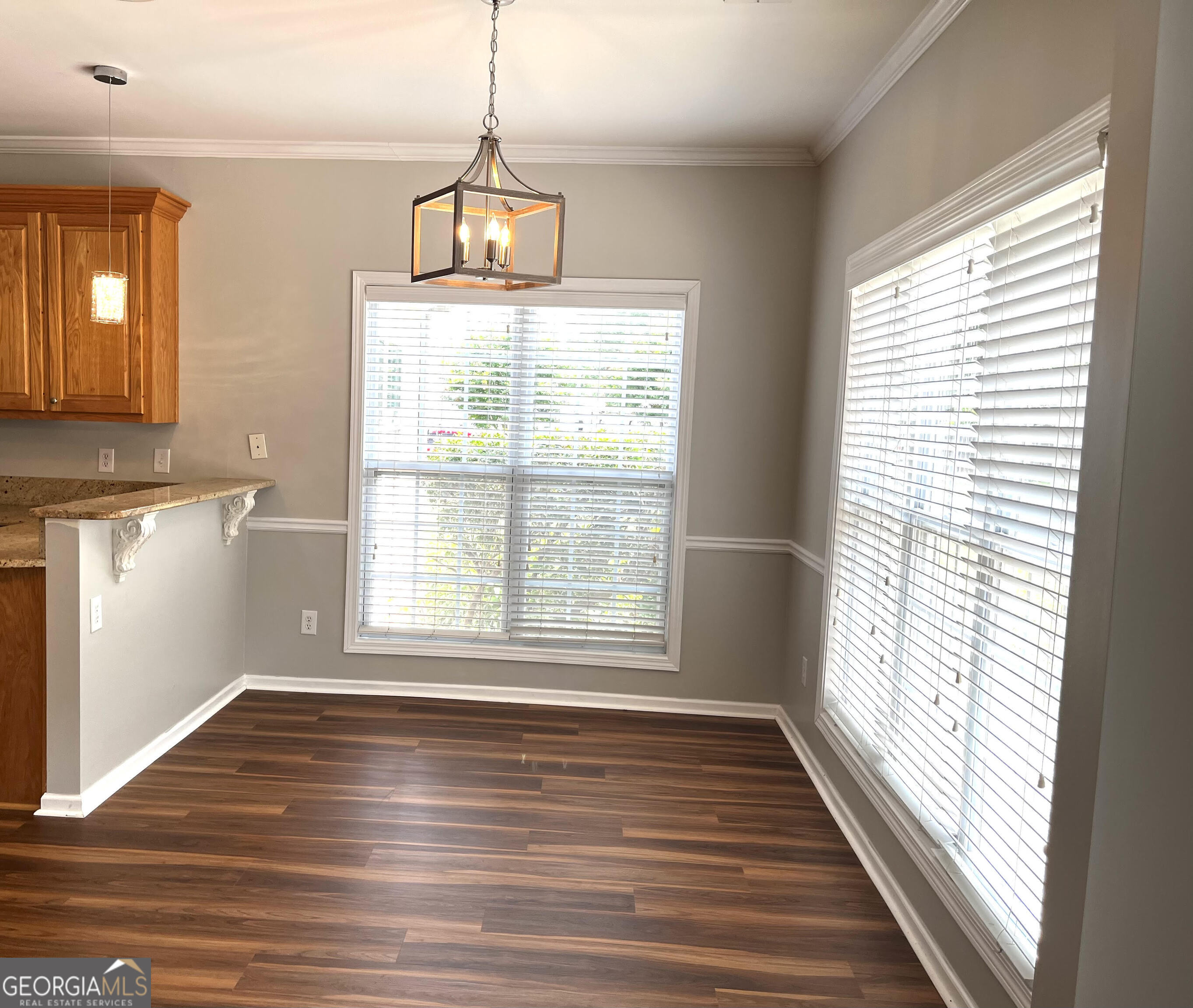 779 Appian Way Statham, GA 30666 - Photo 10 of 29 a view of an empty room with wooden floor and a window