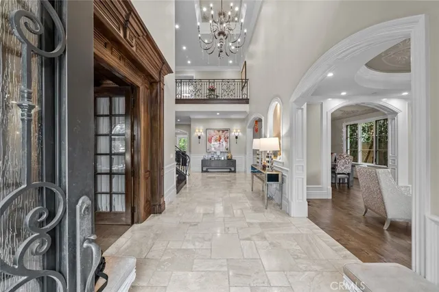a bathroom with a granite countertop sink a mirror and shower