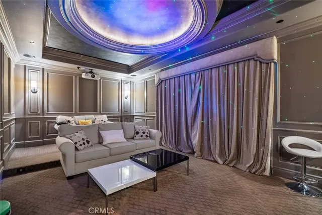 a kitchen with a stove a sink a dining table and chairs