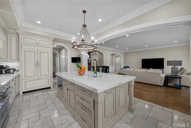 a kitchen with granite countertop a sink and a stove