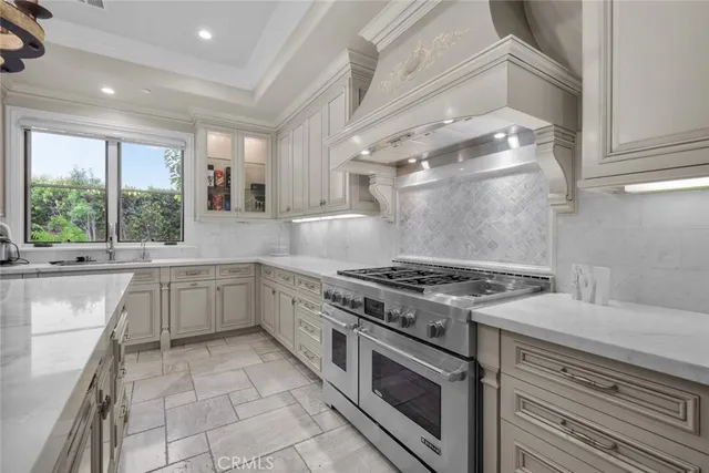 a view of a patio with table and chairs under an umbrella with a fire pit