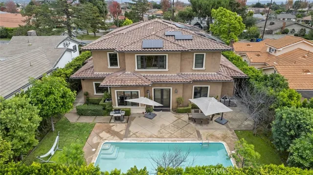 a view of a dining room with furniture and chandelier