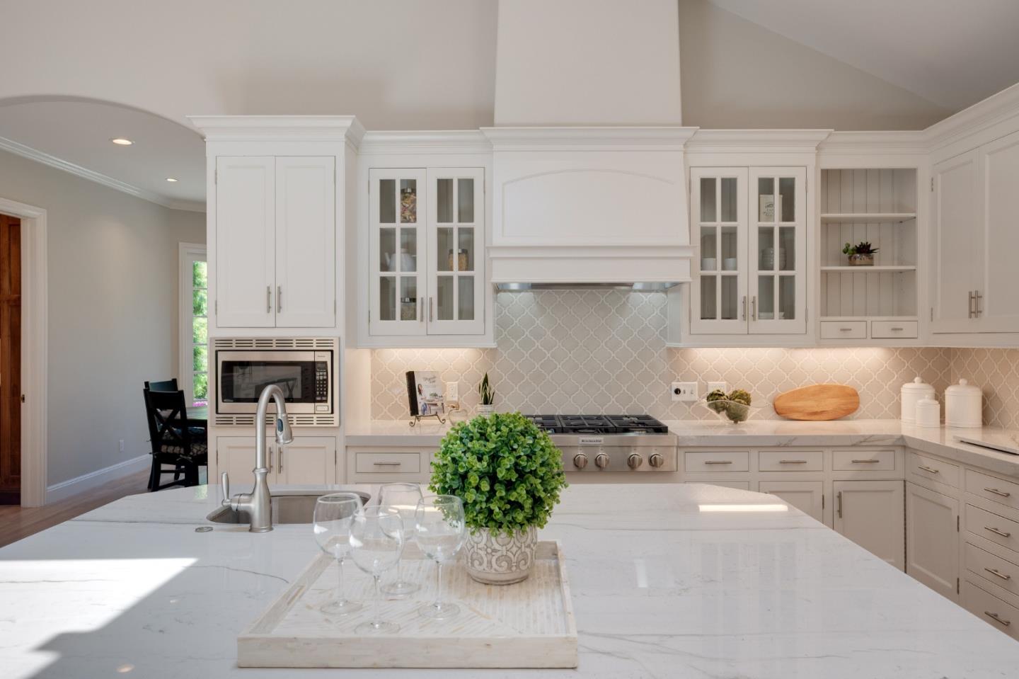 1230 Avondale Road Hillsborough, CA 94010 - Photo 12 of 73 a kitchen with a table and chairs
