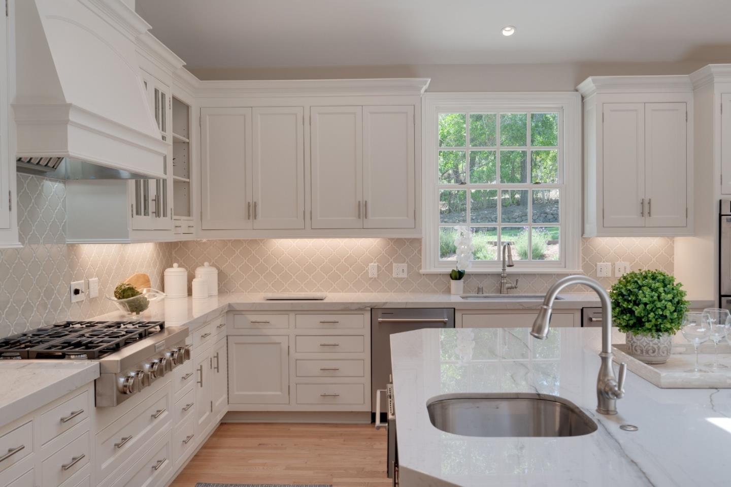 1230 Avondale Road Hillsborough, CA 94010 - Photo 13 of 73 a kitchen with stainless steel appliances granite countertop a sink stove and cabinets