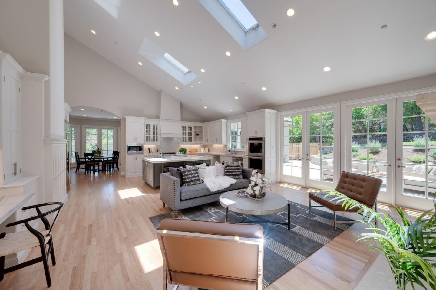 1230 Avondale Road Hillsborough, CA 94010 - Photo 22 of 73 a living room with furniture and floor to ceiling windows