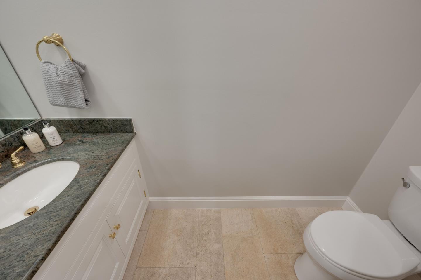 1230 Avondale Road Hillsborough, CA 94010 - Photo 25 of 73 a bathroom with a granite countertop sink and a mirror