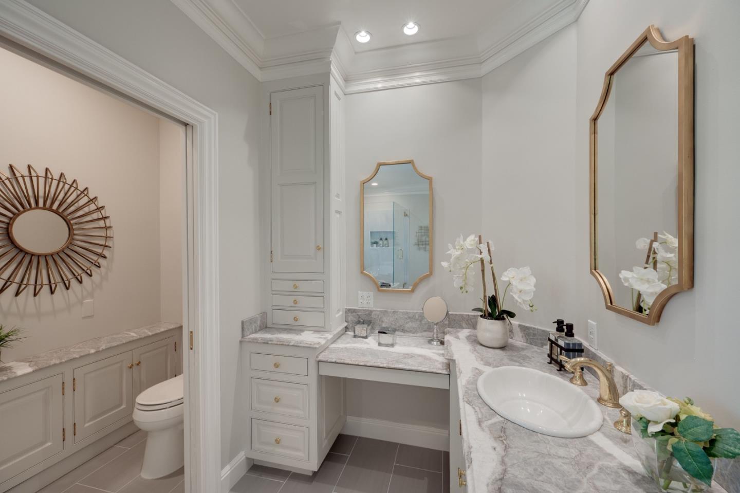 1230 Avondale Road Hillsborough, CA 94010 - Photo 33 of 73 a bathroom with a toilet sink double vanity and mirror