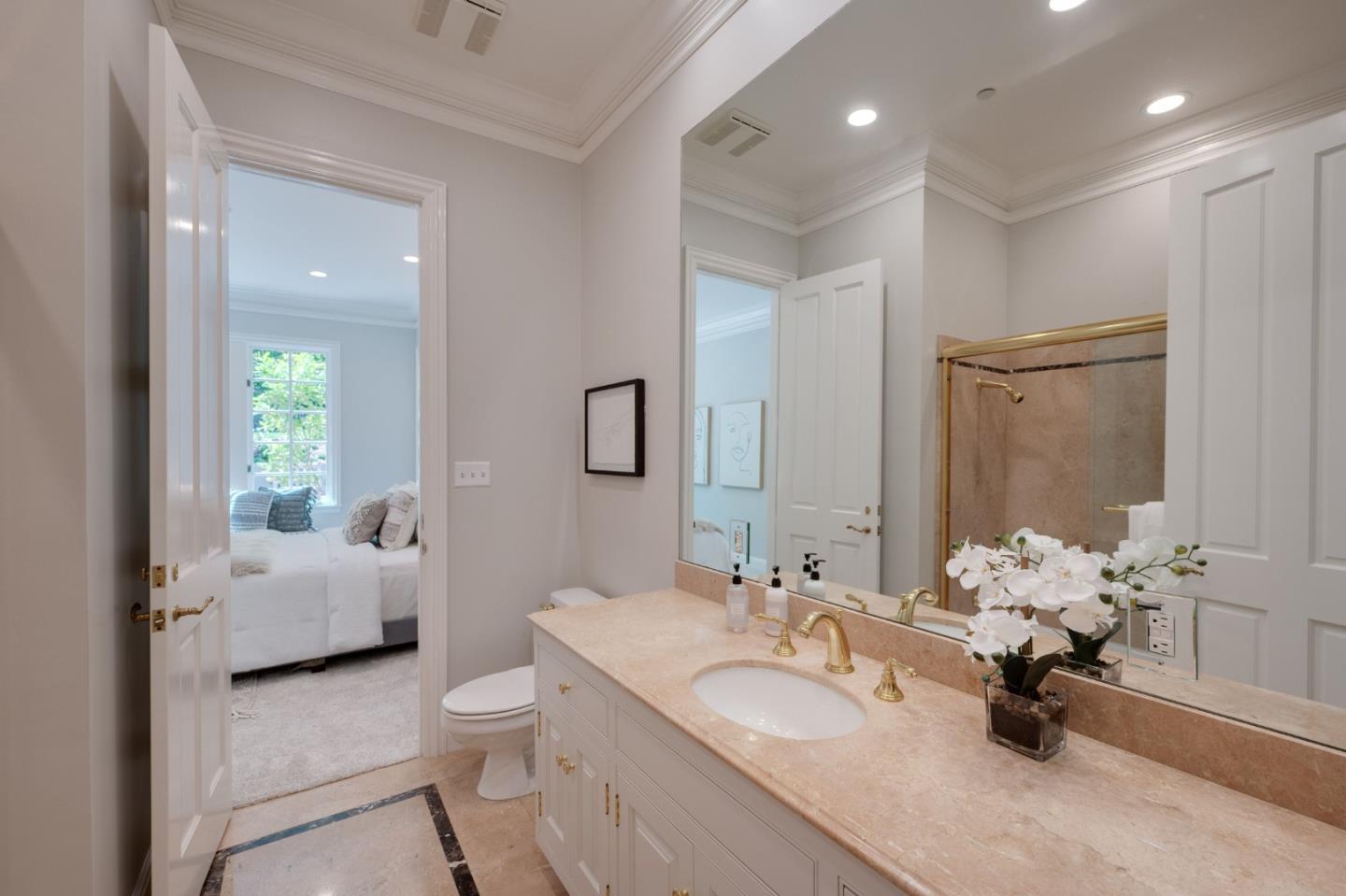1230 Avondale Road Hillsborough, CA 94010 - Photo 47 of 73 a bathroom with a double vanity sink toilet and a mirror