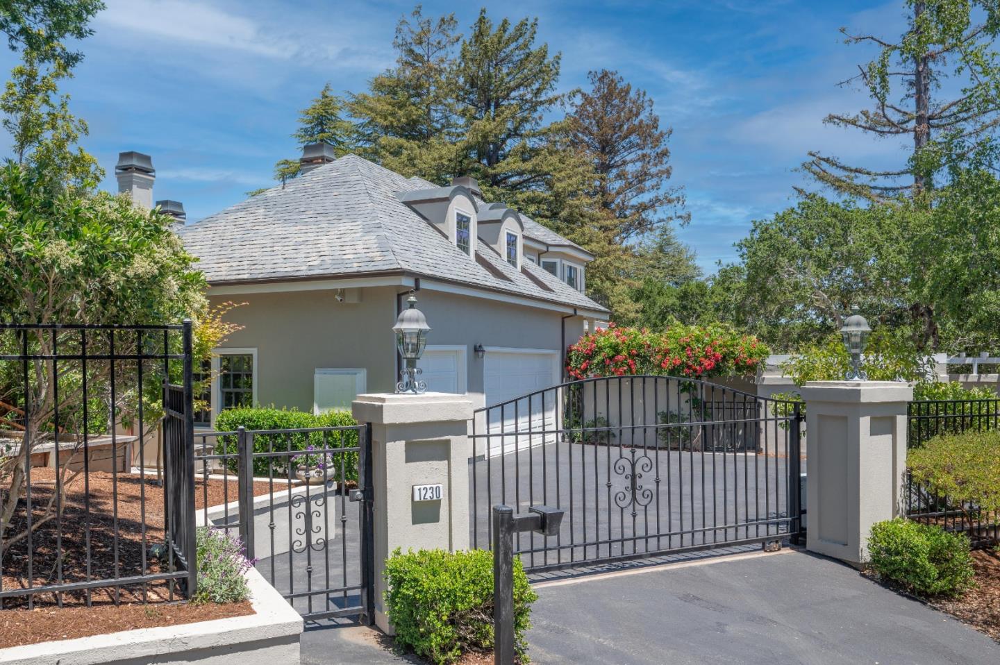 1230 Avondale Road Hillsborough, CA 94010 - Photo 54 of 73 a front view of a house with a garden