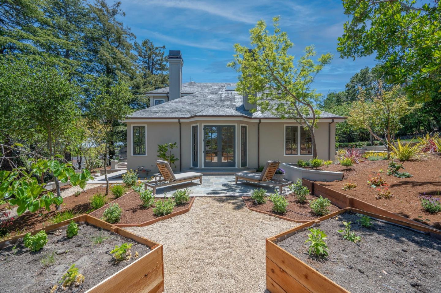 1230 Avondale Road Hillsborough, CA 94010 - Photo 62 of 73 a view of a house with backyard sitting area and garden