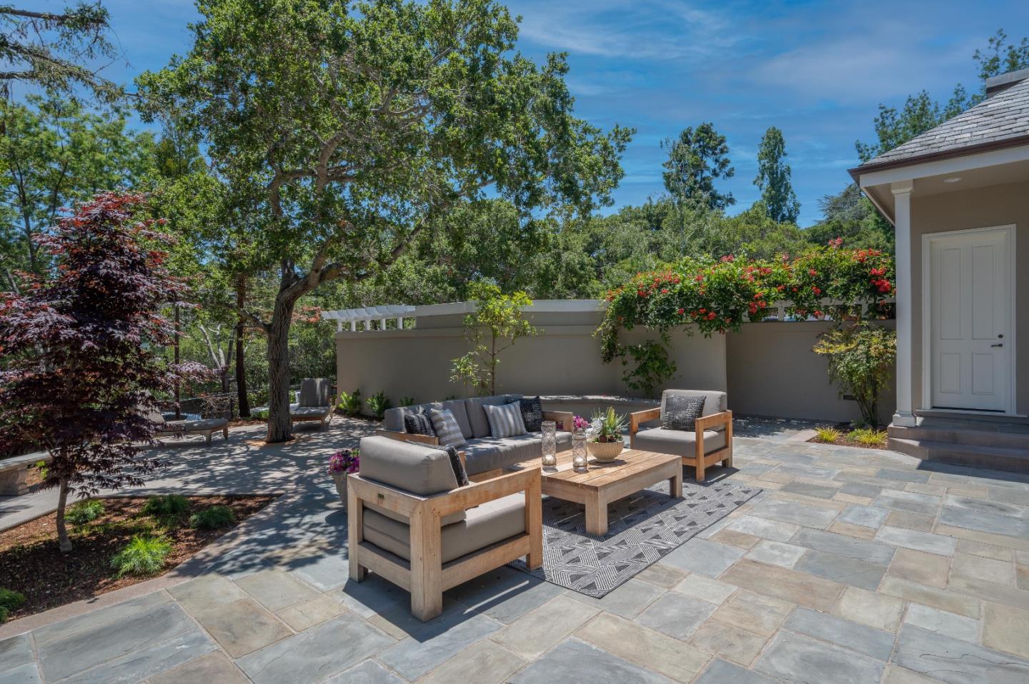1230 Avondale Road Hillsborough, CA 94010 - Photo 67 of 73 a view of a patio with a table and chairs under an umbrella
