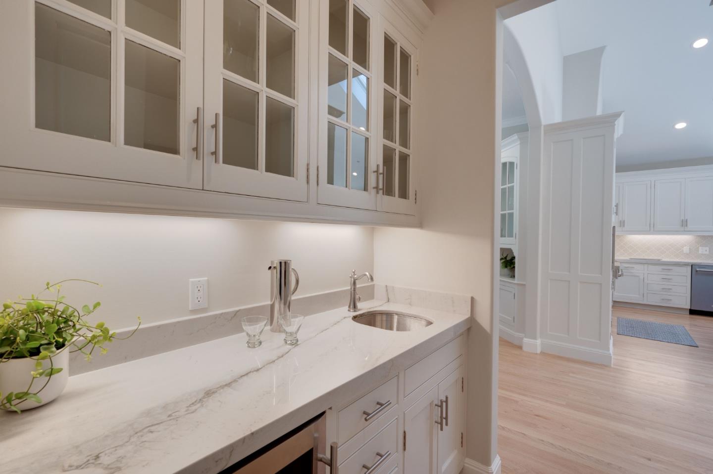1230 Avondale Road Hillsborough, CA 94010 - Photo 10 of 73 a kitchen with a sink and a potted plant