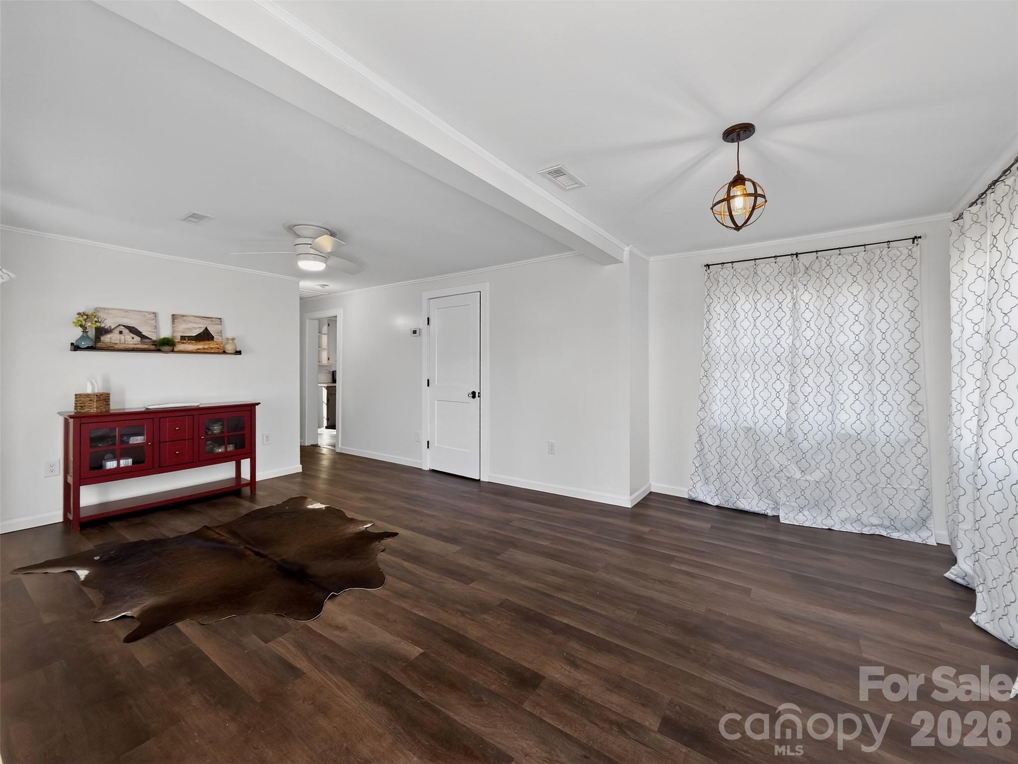 161 Walker Lake Road Forest City, NC 28043 - Photo 12 of 21 a view of an empty room with wooden floor and a fireplace