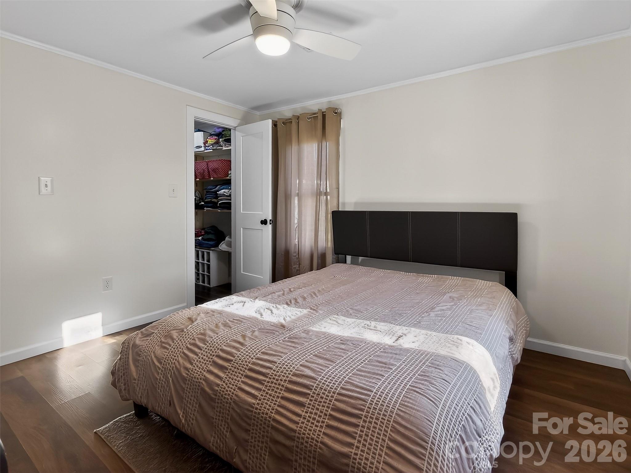 161 Walker Lake Road Forest City, NC 28043 - Photo 13 of 21 a bedroom with a bed and a ceiling fan