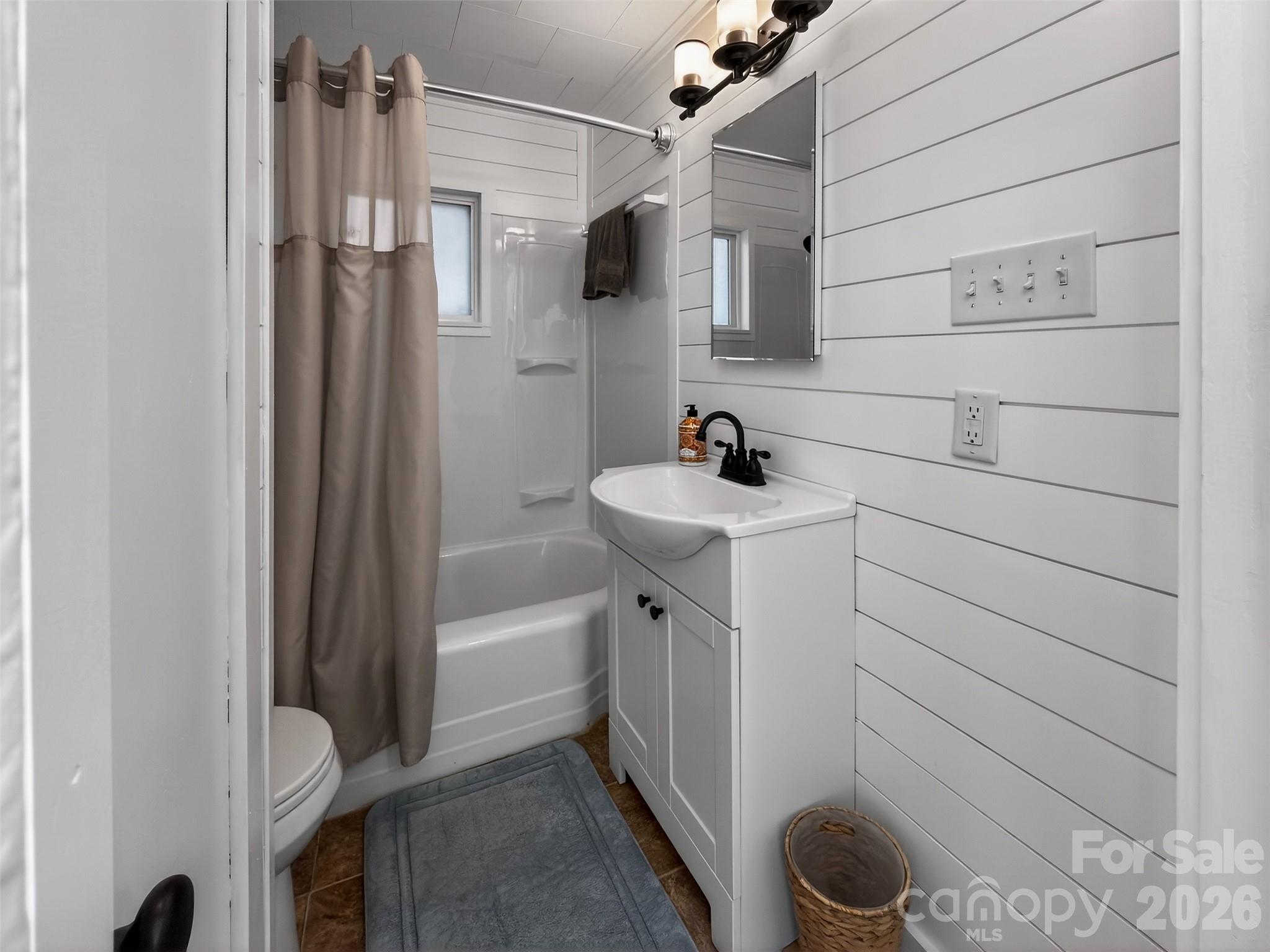161 Walker Lake Road Forest City, NC 28043 - Photo 17 of 21 a bathroom with a sink a toilet and shower