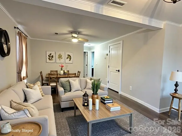 a living room with furniture and a table